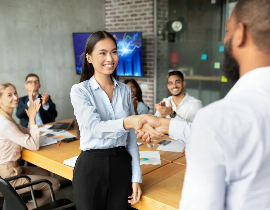 Recruiter congratulating a candidate